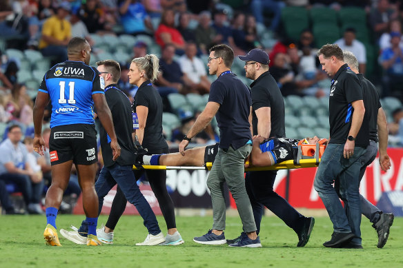 Ollie Callan of the Force is stretchered from the field during the round 6 match.