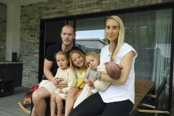 Melbourne mum and nutrition coach Danni Duncan with her husband  Chris and their children Harper, 6, twins Beau and Harlow 3, and newborn London at their home.