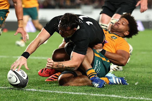 Leroy Carter of the All Blacks touches down for a try.
