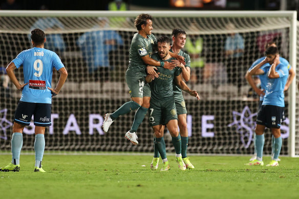 Mathew Leckie celebrates his late winner.