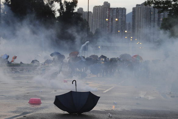 An umbrella is abandoned as protesters pull back from tear gas on Monday afternoon.