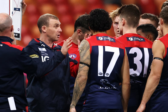 Demons coach Simon Goodwin speaks to players during round six. 