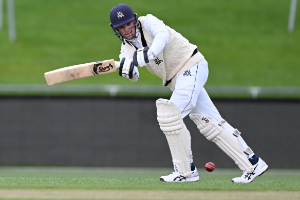 Peter Handscomb of the Bushrangers hits a boundary during the Sheffield Shield match between Tasmania and Victoria. 