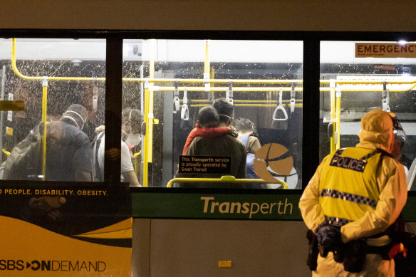 People arriving from Afghanistan are transported on a bus arriving at the Hyatt Hotel in Perth.