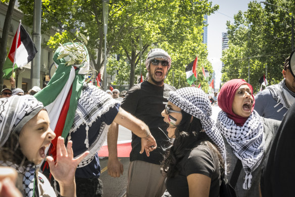 Free Palestine protesters chant during the march on Sunday.