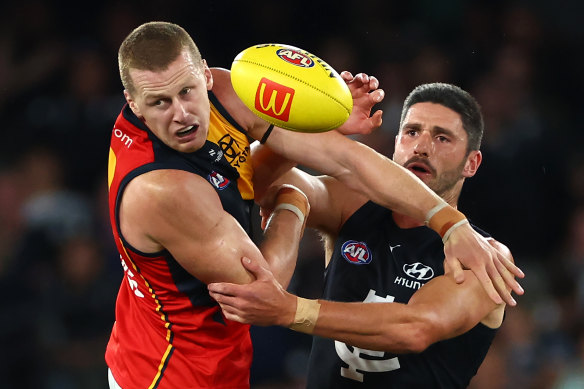 Reilly O’Brien of the Crows and Marc Pittonet of the Blues compete in the ruck.