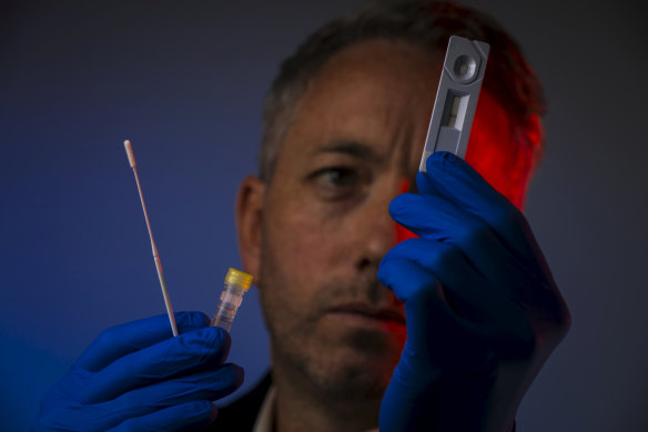 Peter Walsh with one of the rapid diagnostic tests, which he hopes will roll out in aged care facilities.