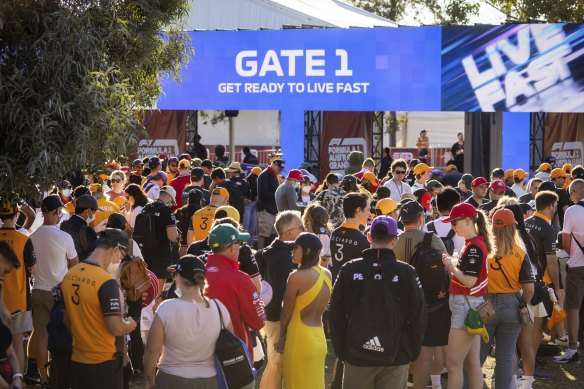 Crowds gather at the gate of the Australian Grand Prix before the final day of racing in Melbourne last year. 