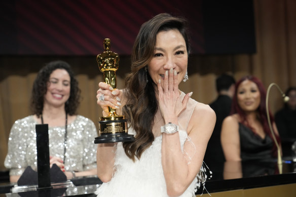 Michelle Yeoh grips her Oscar. “Ladies, don’t ever let anybody tell you that you’re past your prime,” she said in her speech.