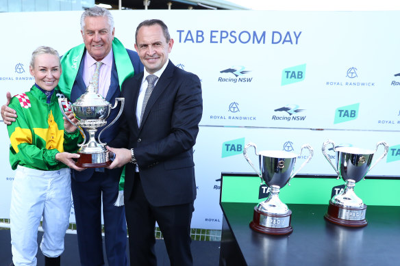Trainer Chris Waller and jockey Kathy O’Hara celebrate after Rediener’s victory in the Epsom.