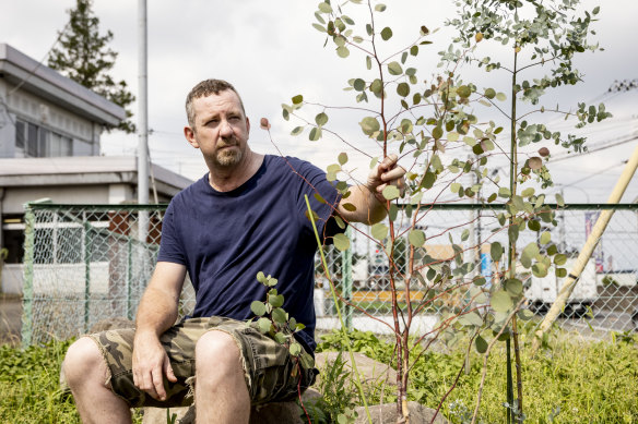 Kav sits next to one of his eucalyptus trees in Shinto Village. 