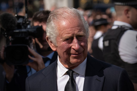 King Charles arriving at Buckingham Palace.