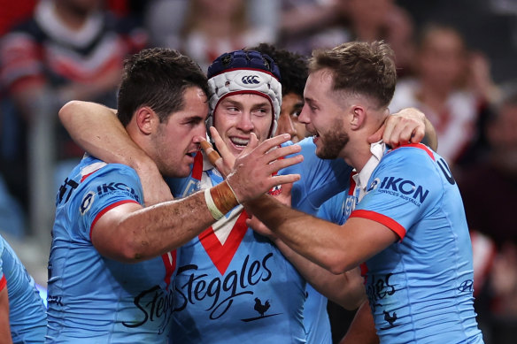 Nat Butcher, Luke Keary and Sam Walker celebrate a try on Anzac Day.