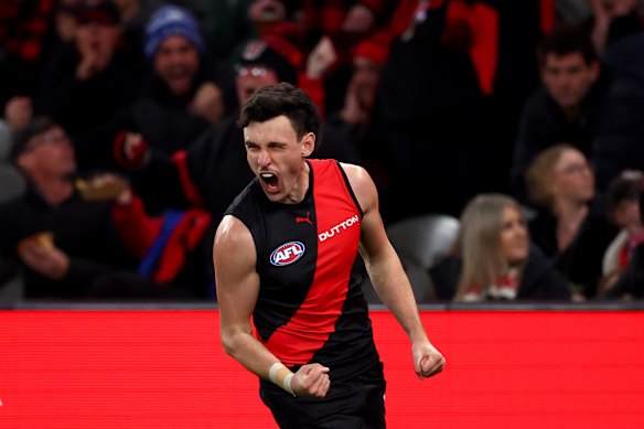 Liam McMahon of the Bombers celebrates kicking a goal.
