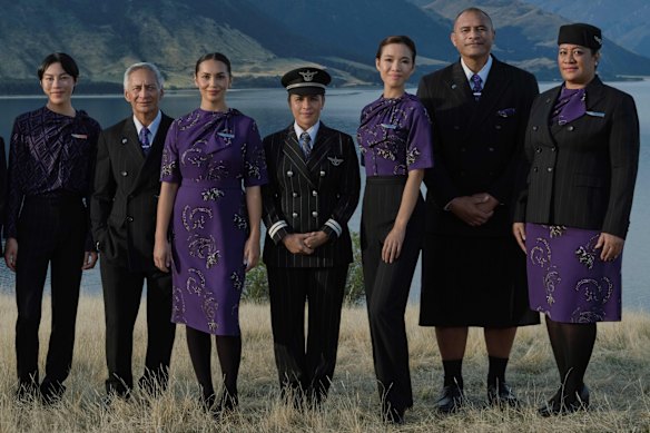 Cabin crew and ground staff in the Air New Zealand uniforms by designer Emilia Wickstead and artist Te Rangitu Netana.