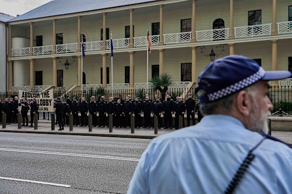 Police monitor the National Socialist Network rally outside parliament on Saturday.