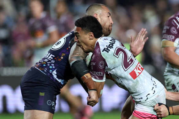 Lehi Hopoate of the Sea Eagles is tackled by Nelson Asofa-Solomona of the Storm.