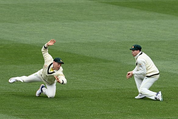 Steve Smith takes a catch despite a dive from Marnus Labuschagne.