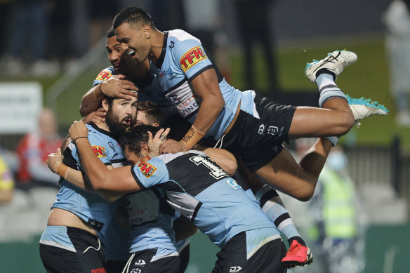 Aaron Woods of the Sharks celebrates a try.