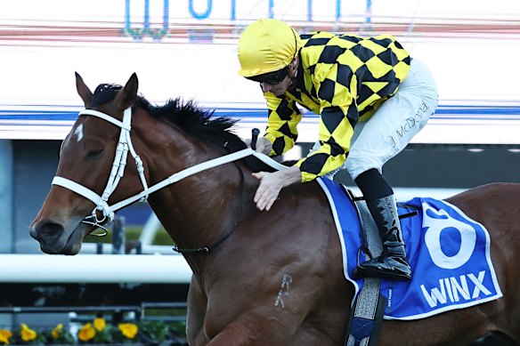 James McDonald gives Autumn Glow a pat after their Winx Stakes win on Saturday at Randwick.