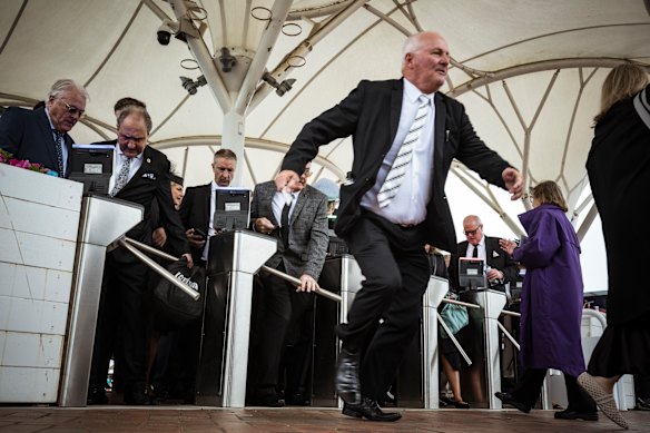 Punters rush into Flemington today.