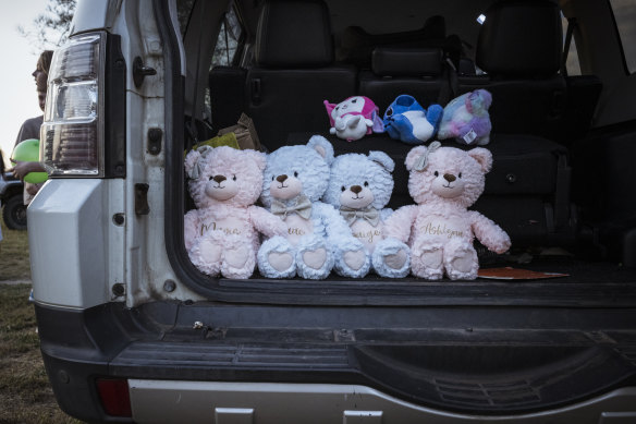 Four teddy bears with the names of the three children who died and the sole survivor of a shed fire in Corio. 