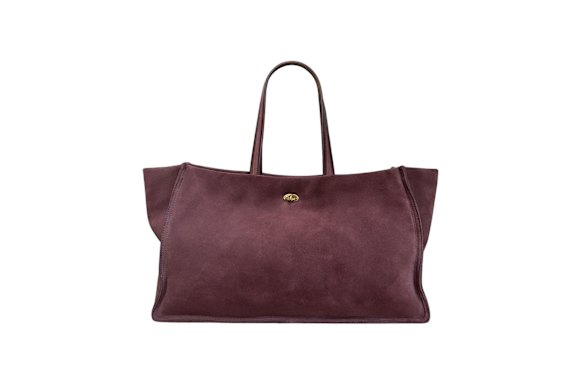 A-Esque “Turn Lock” tote in Suede Plum, $1,300 .