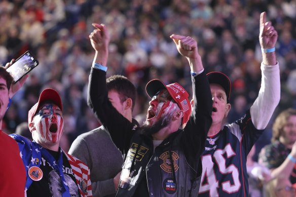 Attendees cheer during a campaign rally for former US president Donald Trump.