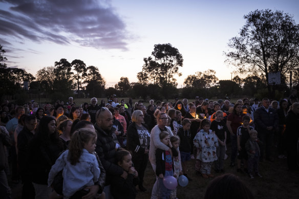 Members of the Corio local community at a vigil in memory of the children who died in the fire.