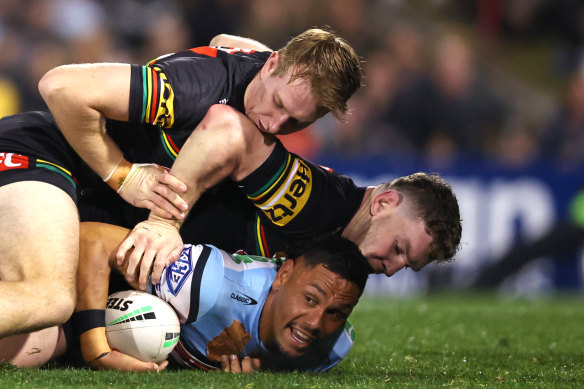 Jesse Ramien is flattened by Zac Hosking and Liam Martin.