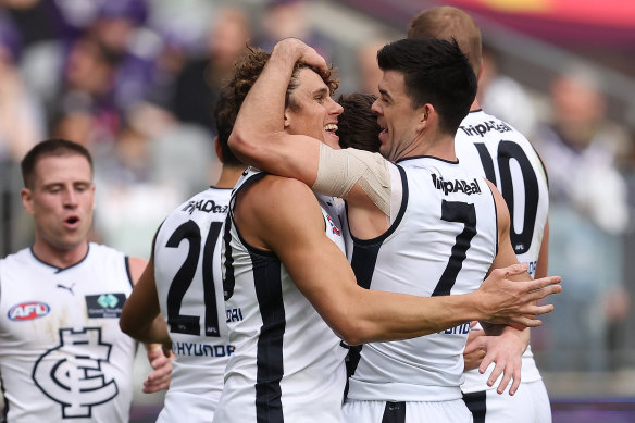 Carlton celebrate a goal against Fremantle.