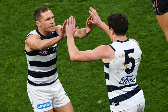 Joel Selwood, left, celebrates a goal with Jeremy Cameron during the 2021 semi-final against GWS. 