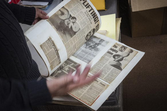 Coffa opens the scrapbooks he has kept since his coaching career began in the 1960s.