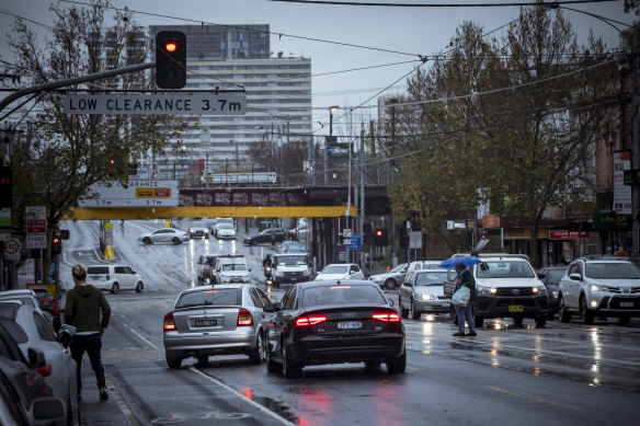 Racecourse Road in Flemington on Friday. State health officials will closely examine coronavirus data over the weekend as the government weighs whether to extend the lockdown to other postcodes. 