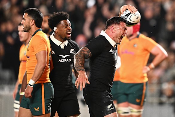 Codie Taylor of the All Blacks celebrates scoring a try.