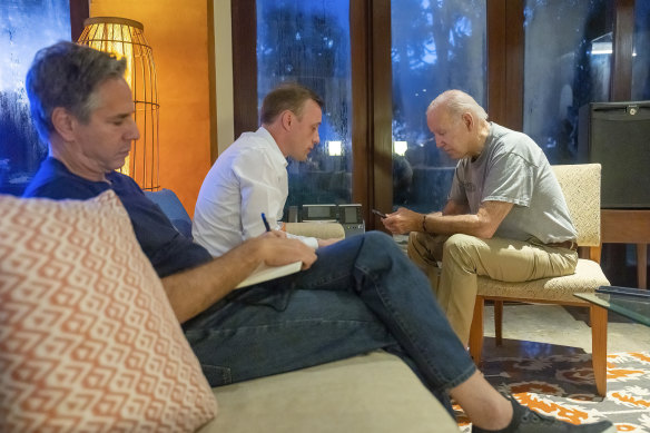 President Joe Biden talks on the phone with Polish President Andrzej Duda, as Secretary of State Antony Blinken (left) and White House national security adviser Jake Sullivan listen in Bali.