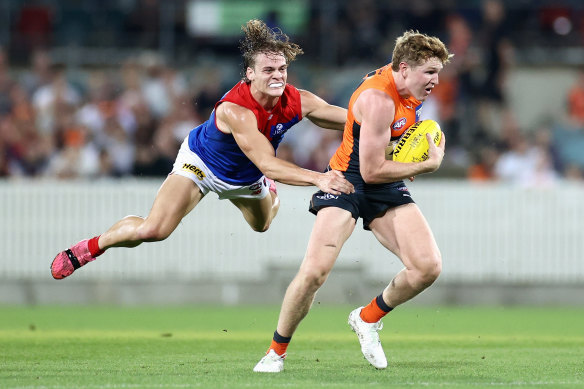 Trent Rivers runs down the Giants’ Tom Green.