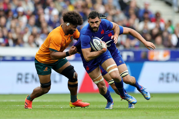 Charles Ollivon, of France, is tackled by Australia’s Rob Valetini.