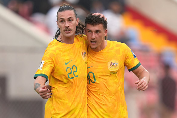 Ajdin Hrustic celebrates his goal with Jackson Irvine.