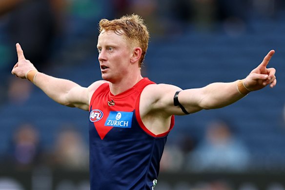 Jake Bowey of the Demons celebrates kicking a goal.
