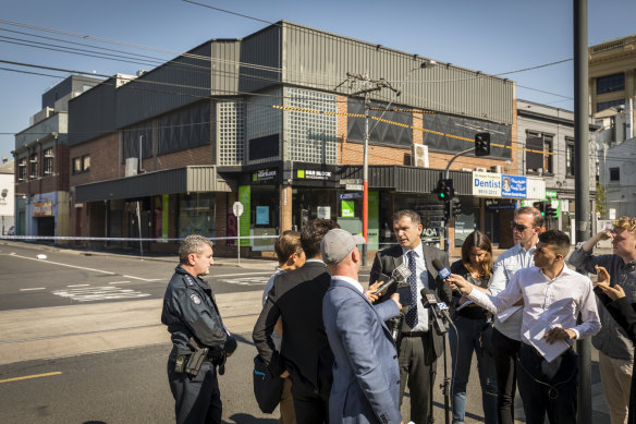 Detective Inspector Andrew Stamper speaks to media at the scene of the Love Machine shooting in 2019. 