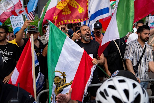 Police work to separate pro-Israeli counterprotesters from a protest against US military strikes in Iran, outside the US Consulate in Toronto, on Sunday.