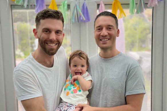 Rob Stott (right) with husband Tony and their daughter Billie.