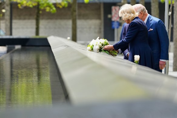 Queen Camilla lays flowers at the 9/11 memorial.