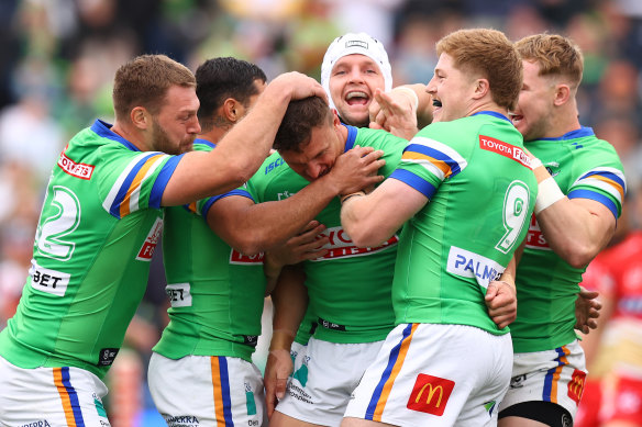 Jack Wighton celebrates with teammates scoring a try against the Dolphins in Wagga Wagga on Saturday.