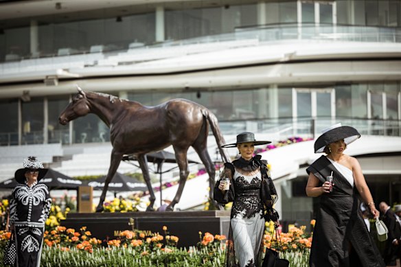 Racegoers in traditional Derby Day Black and White at Flemington