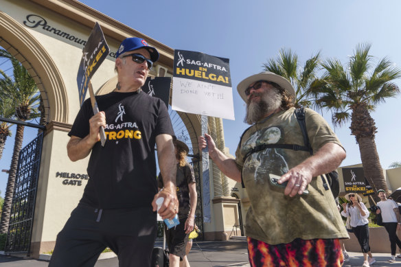Actors Bob Odenkirk, left, and Jack Black join demonstrators outside the Paramount Pictures Studio in Los Angeles, on Tuesday. Actors are still on strike with no talks planned.