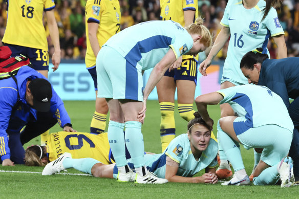 Caitlin Foord receives a bump on her head after clash with Sweden’s Kosovare Asllani.