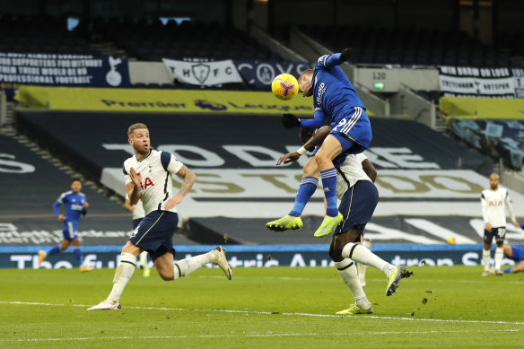 Jamie Vardy flies high for Leicester.