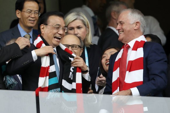 Then premier Li Keqiang and Australia’s then PM Malcolm Turnbull share a joke at an AFL match in Sydney in 2017.